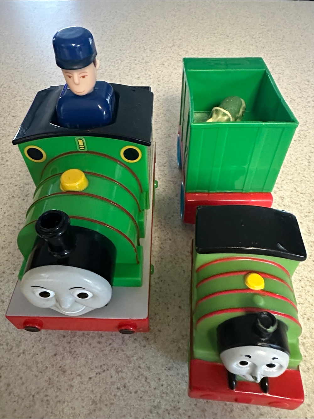 Green Percy the Small Engine toys and cargo cars from Thomas & Friends.